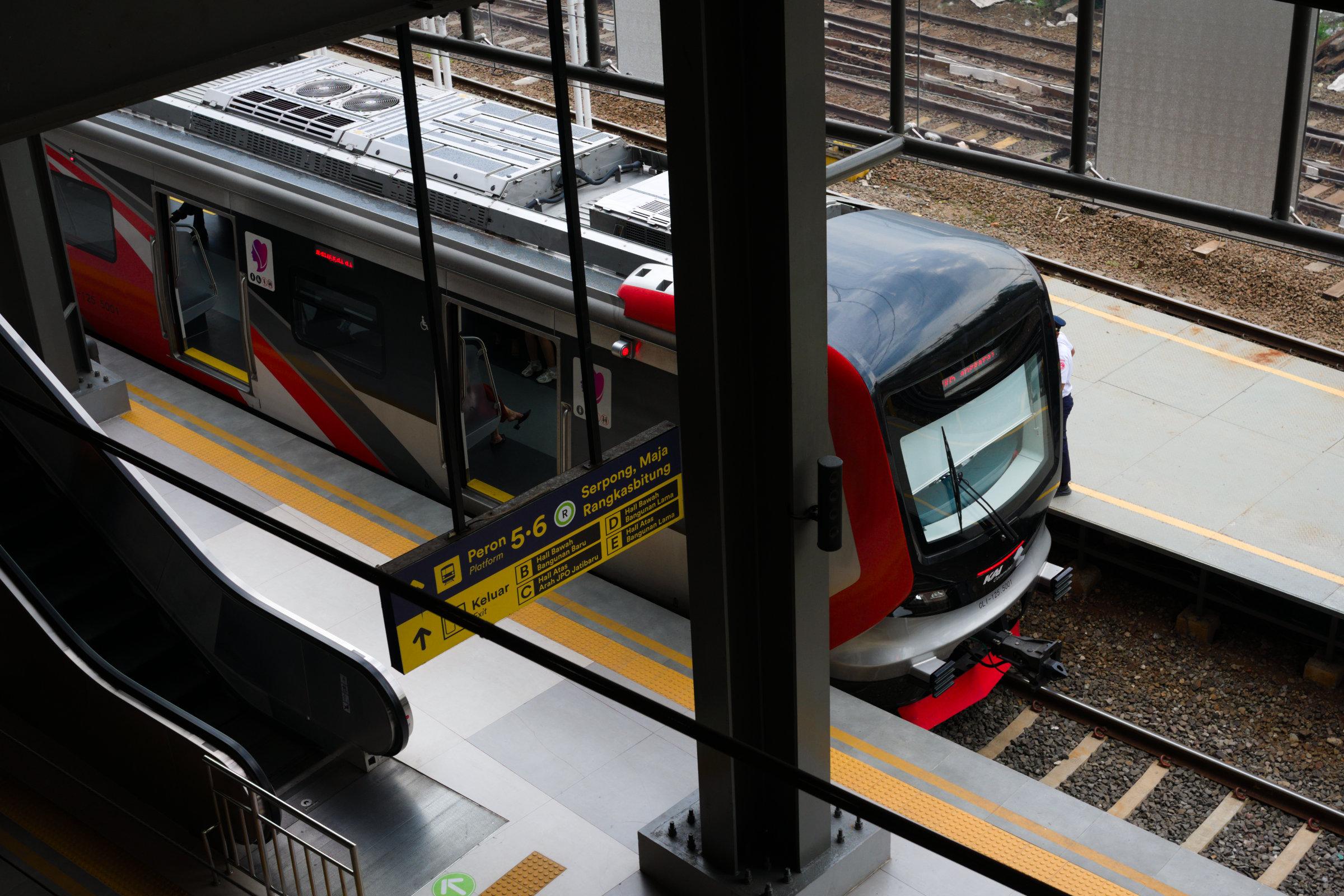 KAI Commuter CLI-125 train stopping to take and drop passengers.
Taken from the concourse level looking down to the platforms.